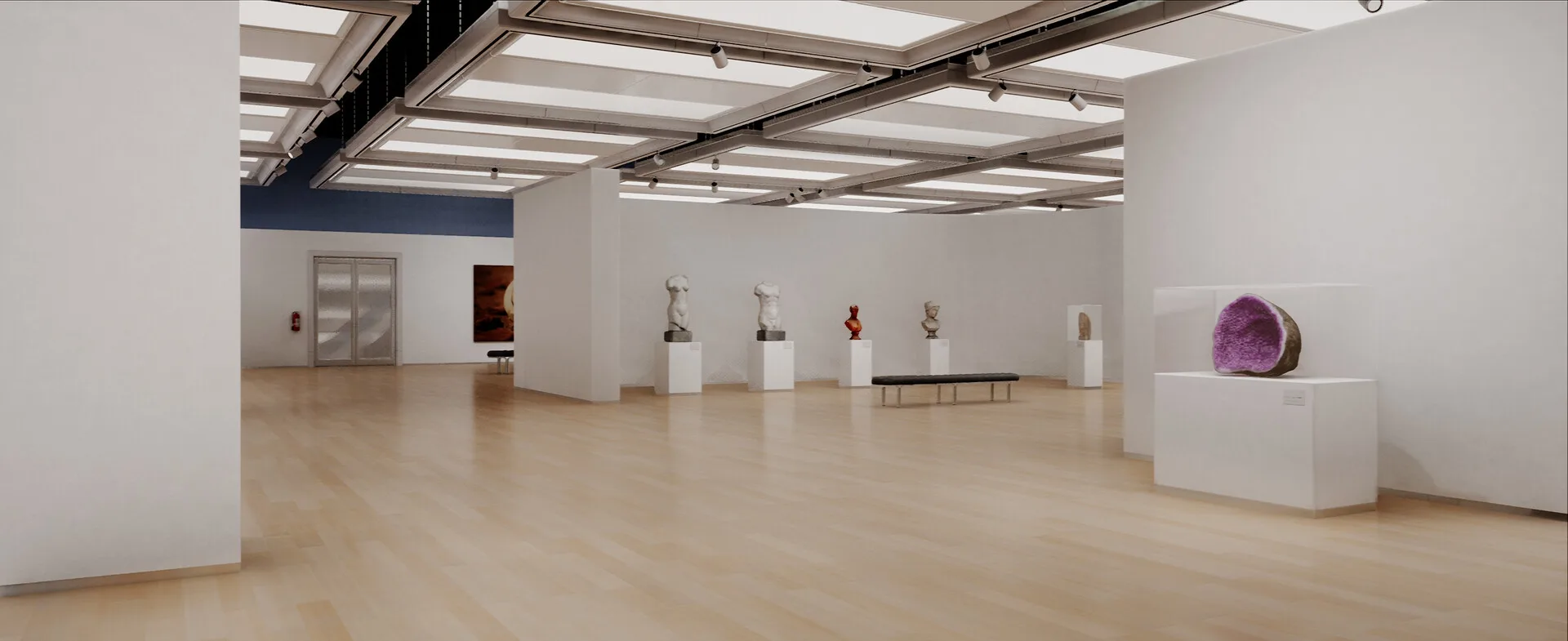 Sala de museu virtual com fotografias de grande formato e bancos ao centro.